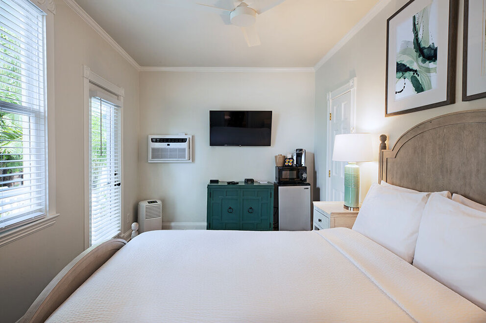 Room #4. Deluxe Queen, ground floor with patio. Back of property.